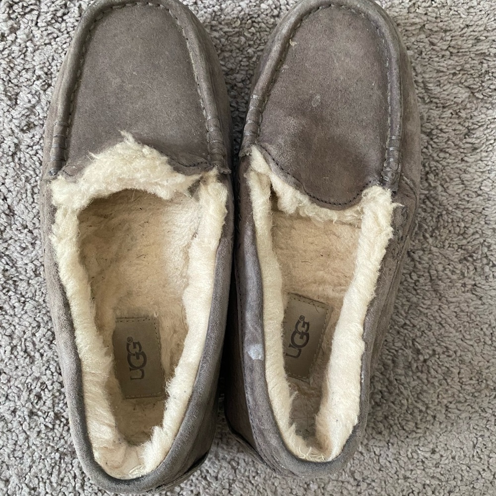 Ugg Slippers size 7. Paint on bottom and a few small specks on surface
